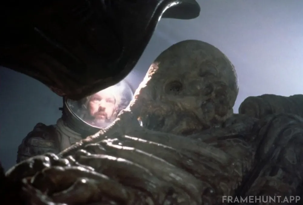 The Nostromo crew discovers a massive, fossilized extraterrestrial pilot inside a derelict alien spaceship. in Alien
