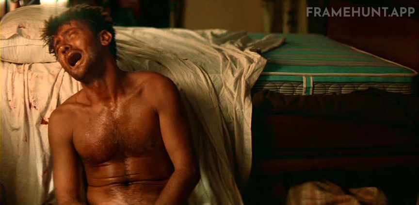 Captain Willard suffers a severe mental breakdown in his hotel room, smashing a mirror and bleeding profusely. in Apocalypse Now