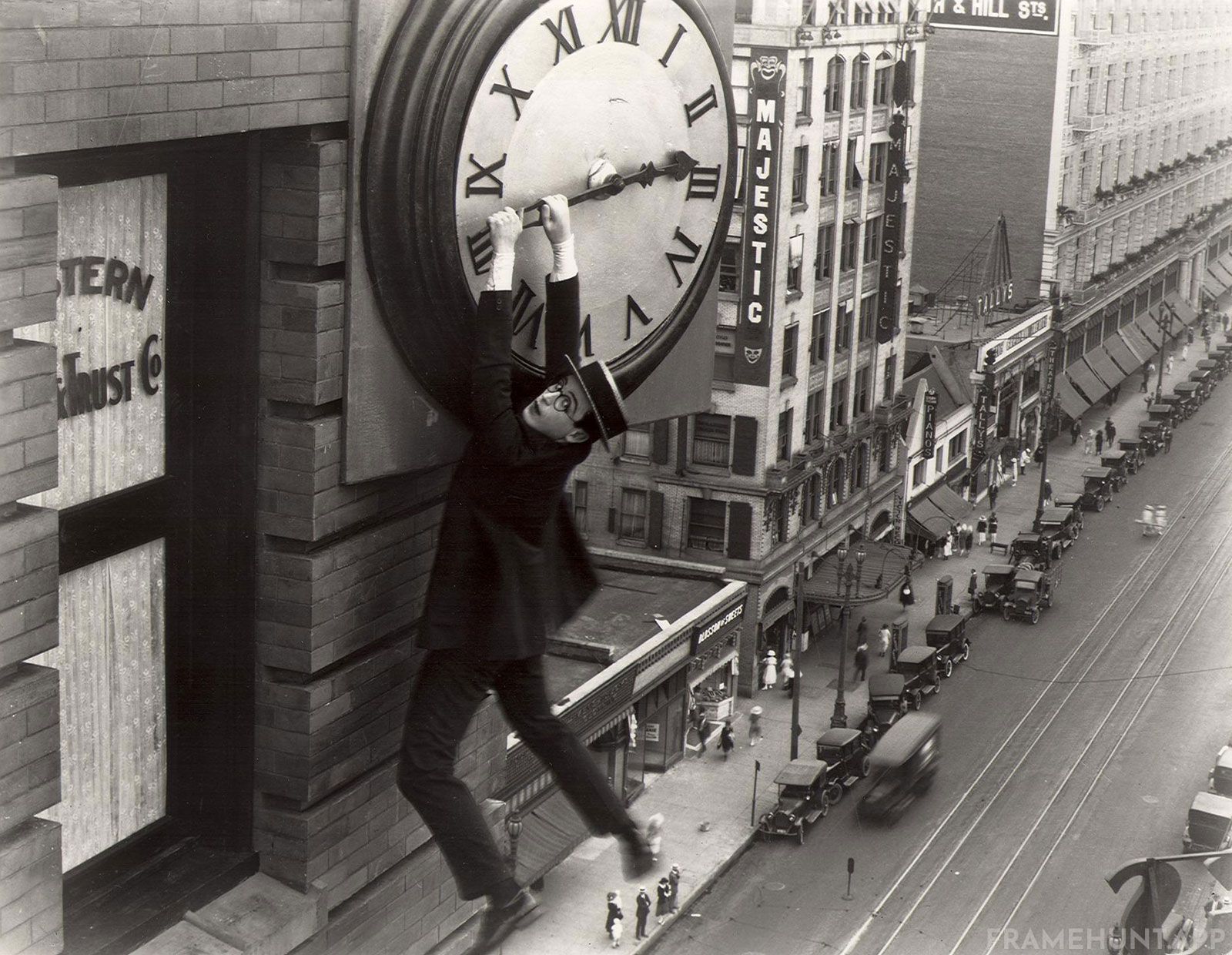 Doc Brown desperately dangling from the hands of the Hill Valley clock tower. in Back to the Future