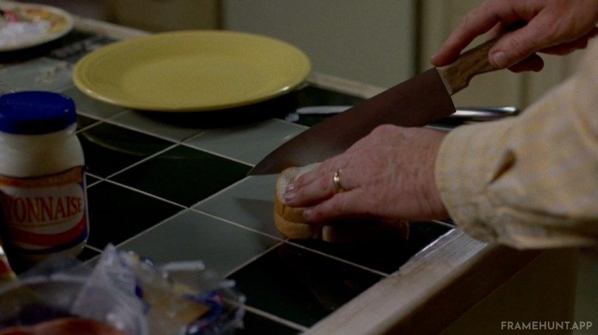 Walt cuts the crusts off his sandwich, subconsciously adopting the specific eating habit of Krazy-8, whom he killed earlier. in Breaking Bad