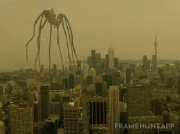 A giant kaiju-sized spider walks across Toronto's skyline — inspired by sculptor Louise Bourgeois's "Maman" (1999)  in Enemy