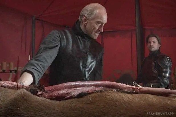 Tywin Lannister is physically gutting and skinning a dead stag, which is the official sigil of House Baratheon. in Game of Thrones