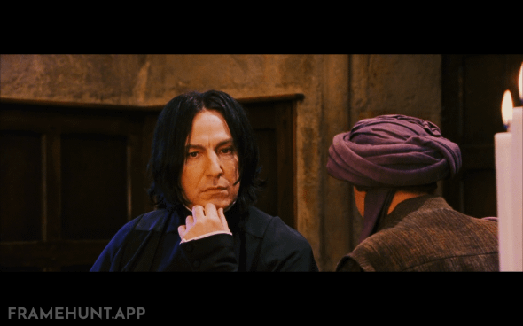 Harry's scar hurts when looking at Snape because Quirrell's turban, hiding Voldemort, is facing directly at him. in Harry Potter and the Philosopher's Stone