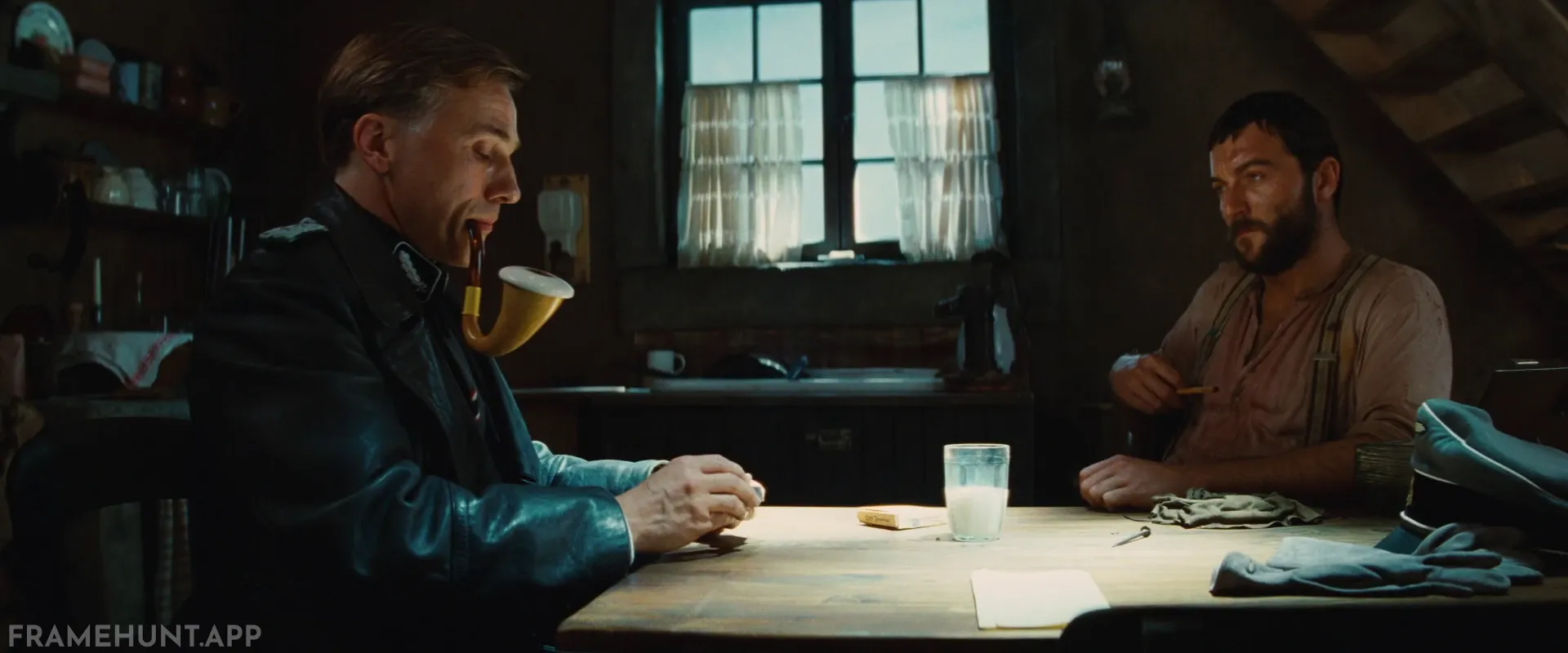 Hans Landa smokes an oversized Calabash pipe to mock the French farmer, directly comparing himself to Sherlock Holmes. in Inglourious Basterds