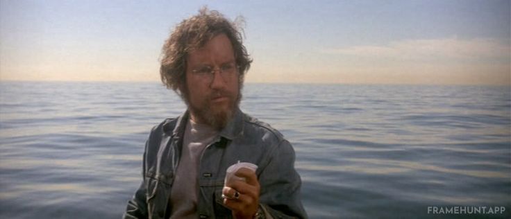 Quint violently crushes a tin beer can with one hand, prompting Hooper to awkwardly crush a tiny styrofoam cup. in Jaws