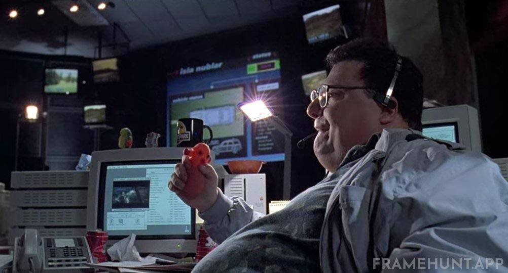 Dennis Nedry is secretly watching Steven Spielberg's Jaws in a small window on his computer. in Jurassic Park