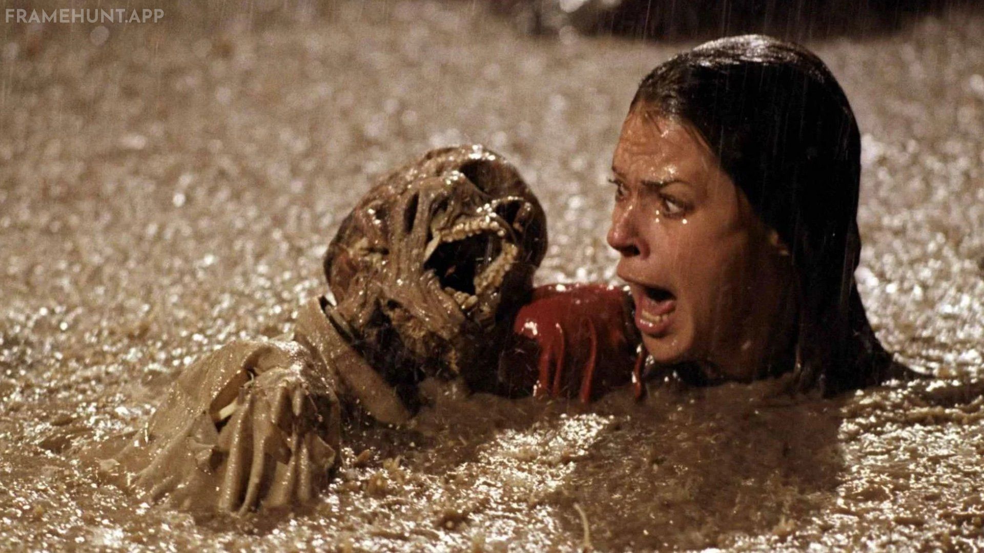 Diane Freeling falls into the muddy, flooded excavation pit in her backyard and is surrounded by terrifying, rising skeletons. in Poltergeist