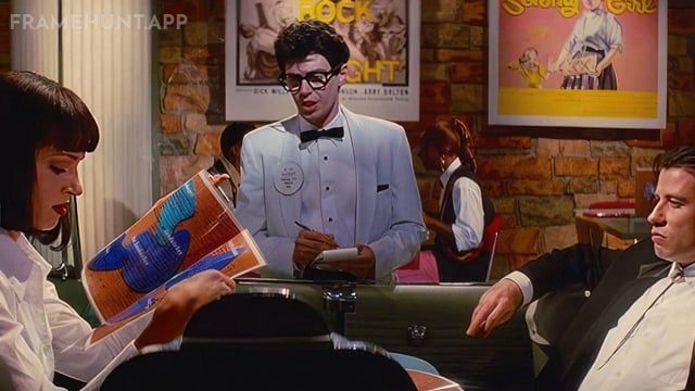 Steve Buscemi plays the Buddy Holly waiter, an ironic nod to his Reservoir Dogs character who famously refused to tip. in Pulp Fiction