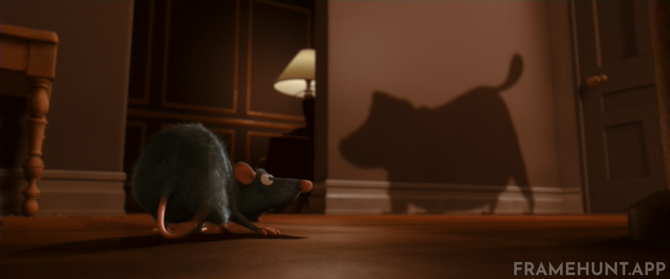 The shadow of the dog that violently barks at Remy belongs to Dug, the lovable golden retriever from Up. in Ratatouille