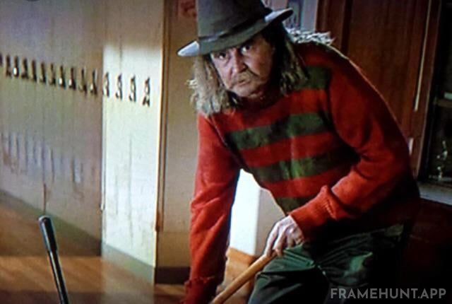 Director Wes Craven makes a brief appearance as a school janitor named Fred, wearing a very familiar red and green striped sweater. in Scream