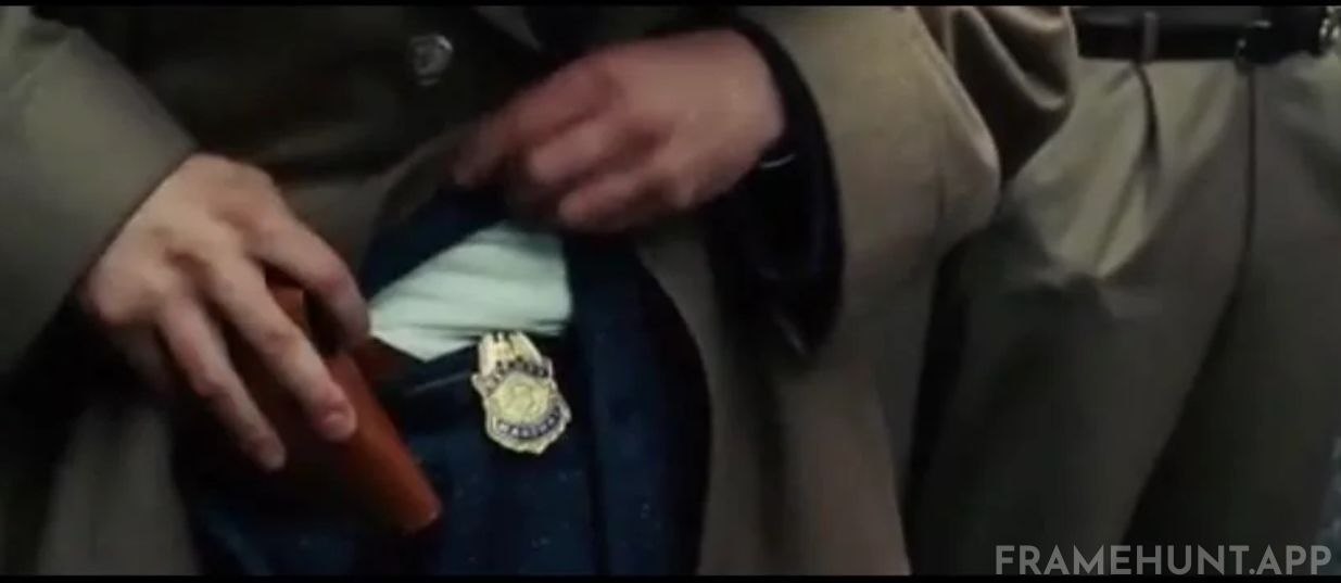 Chuck fumbles awkwardly and struggles to remove his gun from his holster, proving he is not a highly trained US Marshal. in Shutter Island