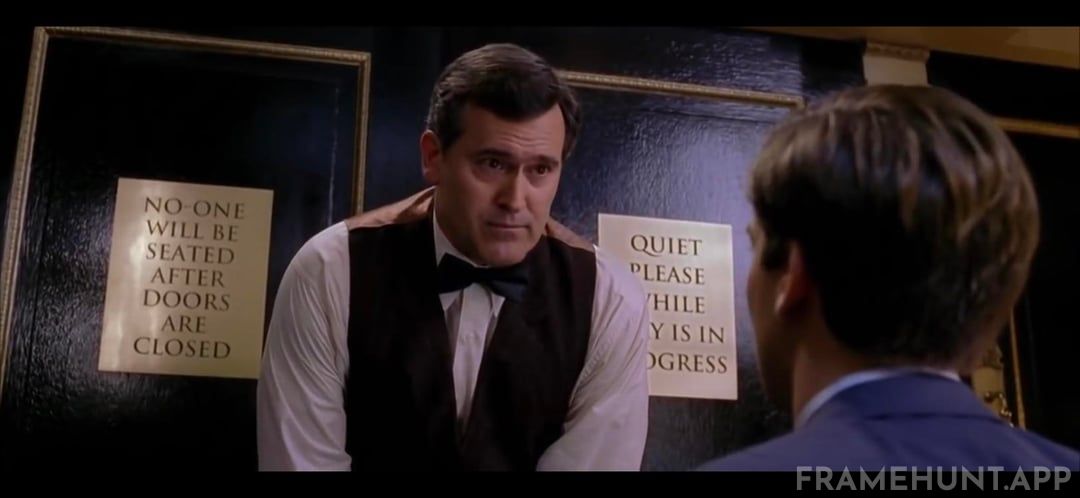 The snooty theater usher who refuses to let Peter Parker inside is horror legend Bruce Campbell. in Spider-Man 2