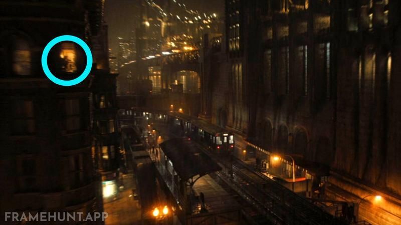 The Riddler is secretly watching the Iceberg Lounge from the window of the opposite building long before he strikes. in The Batman