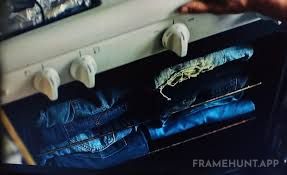 Carmy stores his collection of expensive vintage denim clothing directly inside his home kitchen oven. in The Bear