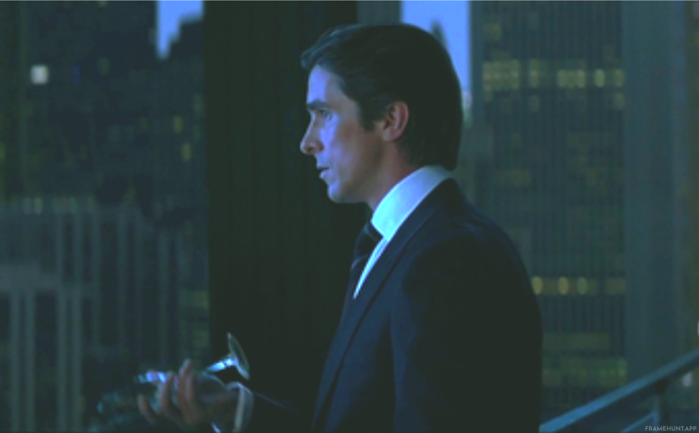 Bruce Wayne walks onto the penthouse balcony and discreetly tosses his entire glass of champagne over the edge instead of drinking it. in The Dark Knight