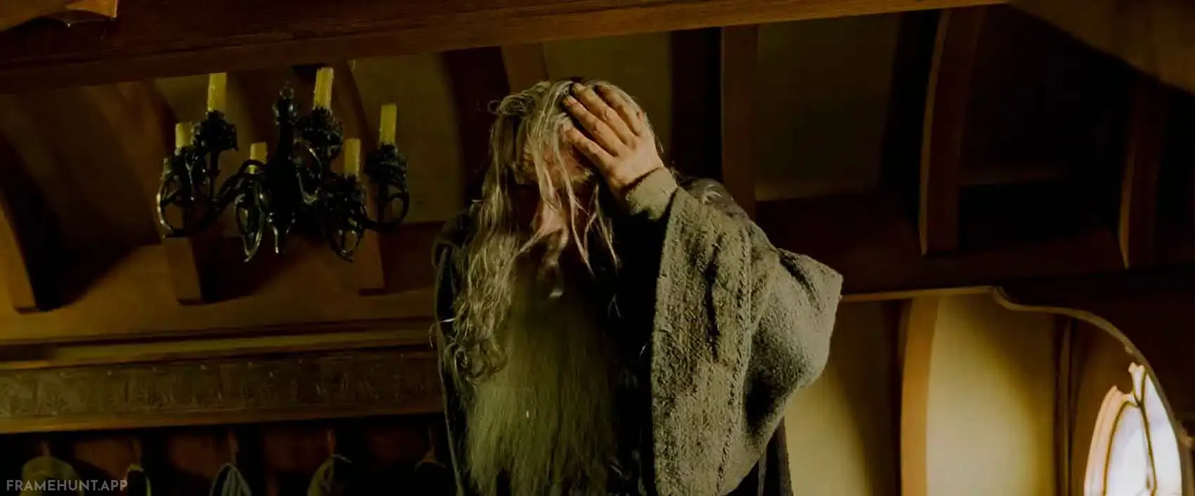 Gandalf painfully hits his forehead on a wooden beam while walking around Bilbo's tiny hobbit hole. in The Lord of the Rings: The Fellowship of the Ring