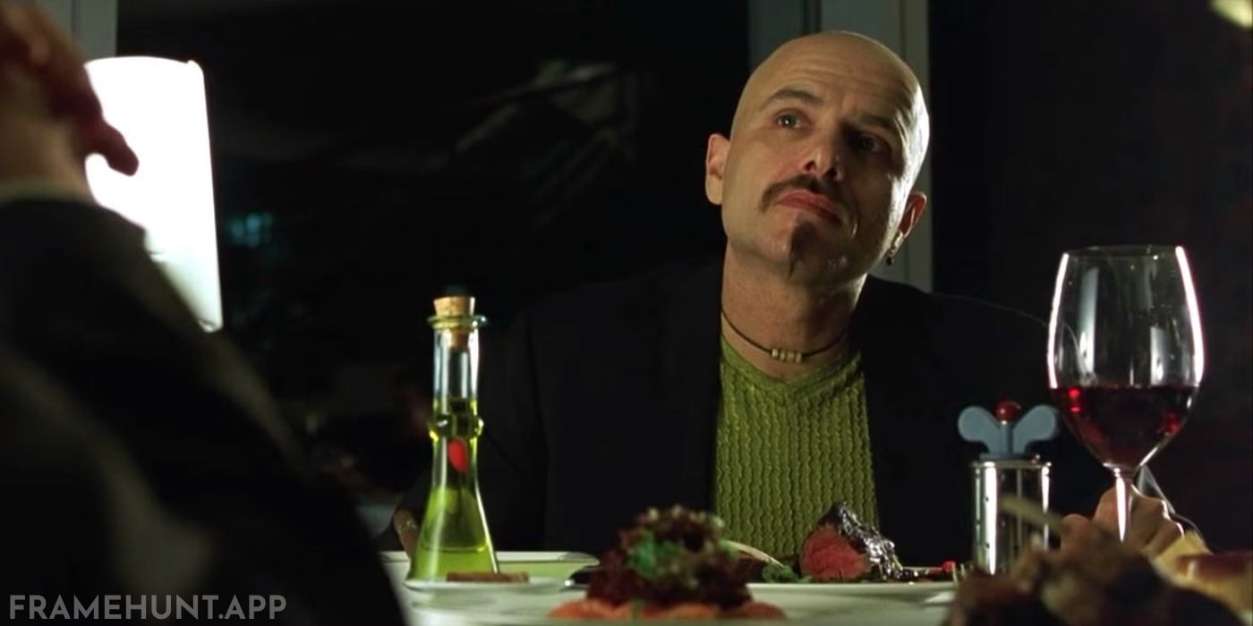 Cypher's clothing and the lighting around him are constantly red, visually marking him as the dangerous "red pill." in The Matrix