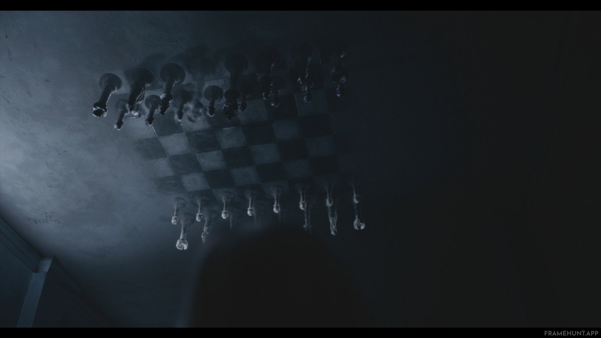 The shadows cast on the ceiling of Beth's orphanage bedroom naturally form the shape of a giant chessboard. in The Queen's Gambit