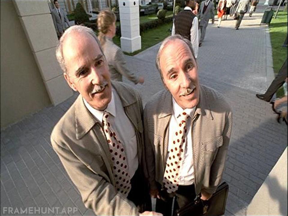 The friendly twins intentionally block Truman's path, pushing him against walls to frame him next to advertisements. in The Truman Show