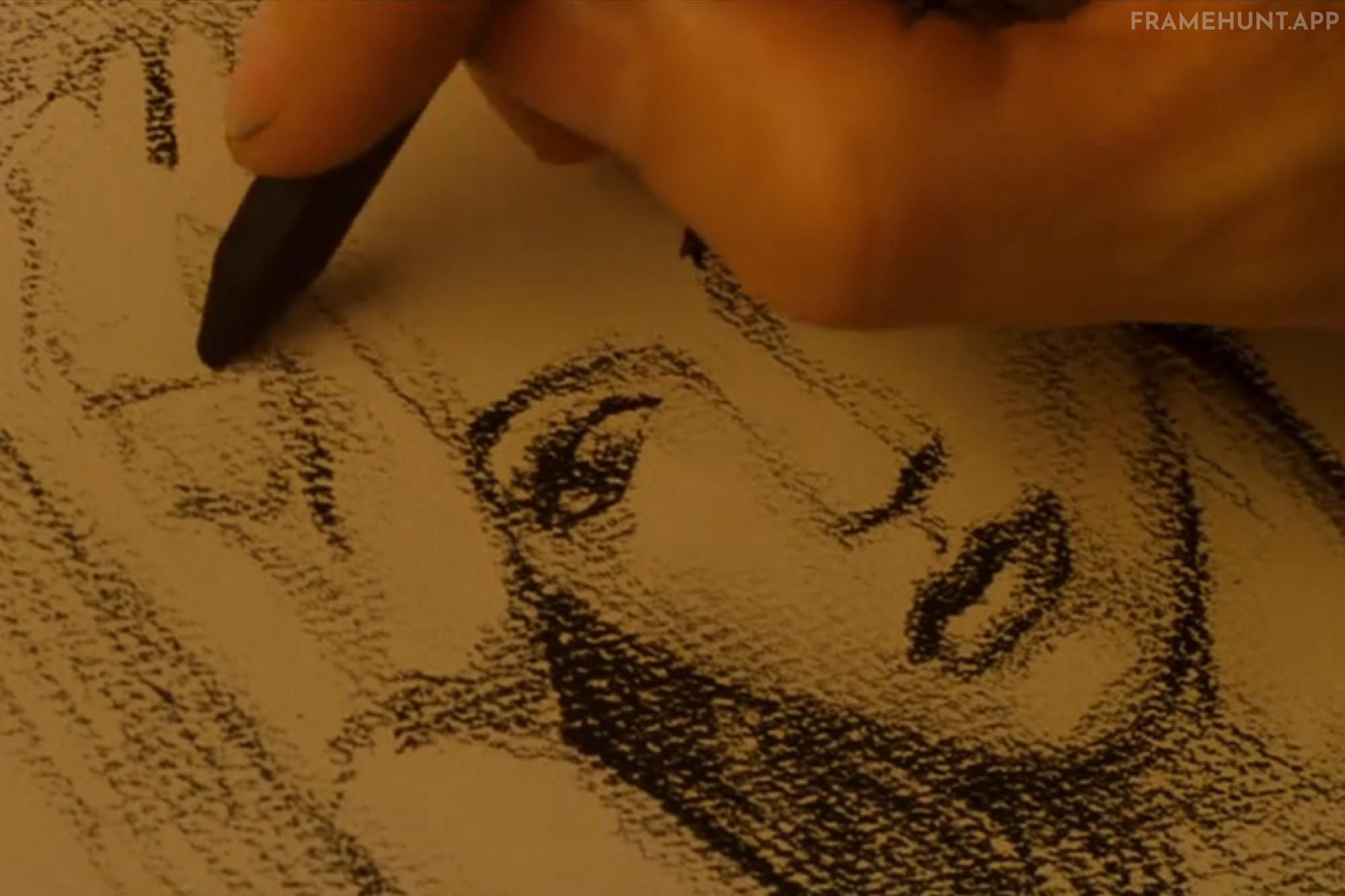 Jack's hands are shown in close-up skillfully sketching Rose wearing the Heart of the Ocean necklace. in Titanic