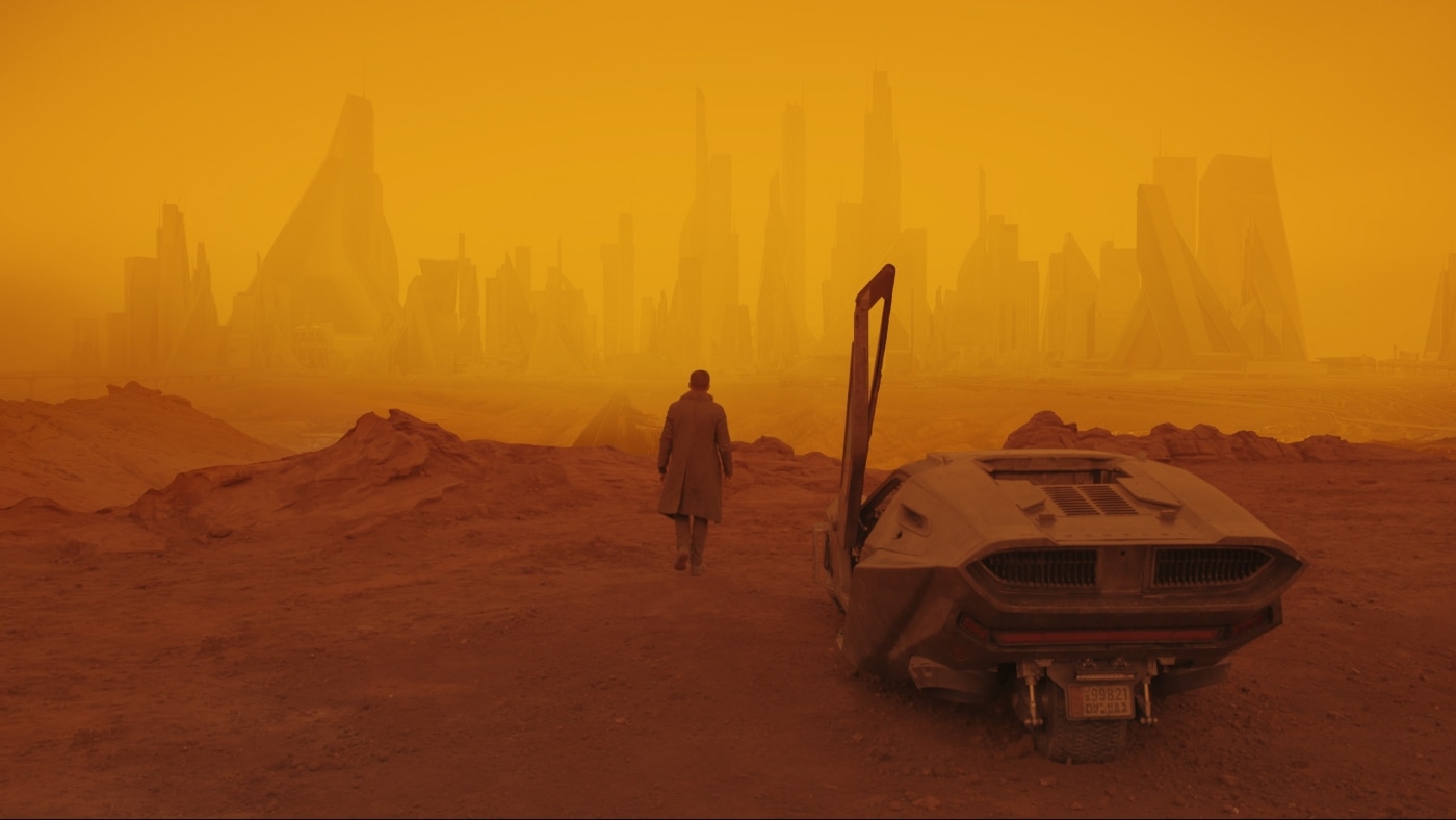 Distinct color coding with yellow and orange is used to define artificial and wasteland environments in Blade Runner 2049