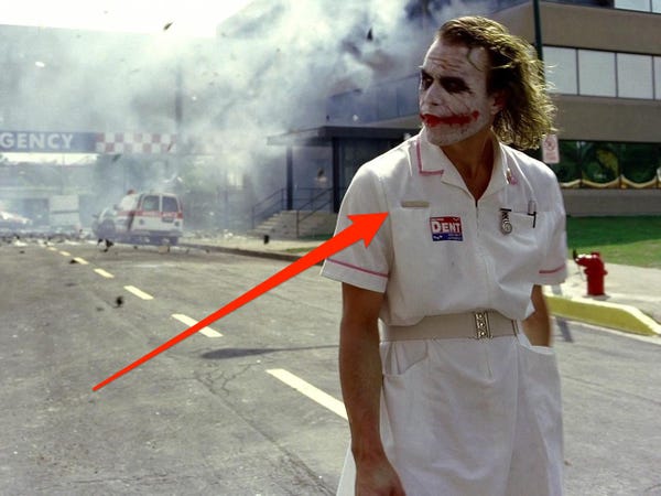 The Joker’s nurse outfit features a name tag that reads "G. Dent" in The Dark Knight