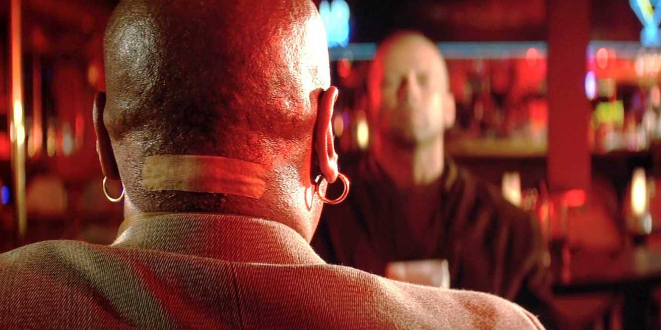 Marsellus Wallace wears a prominent band-aid on the back of his neck. in Pulp Fiction: The Golden Age of Storytelling