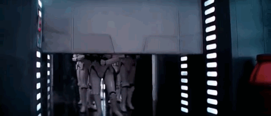 A Stormtrooper comically bumps his head hard on the top of a rising blast door. in Star Wars
