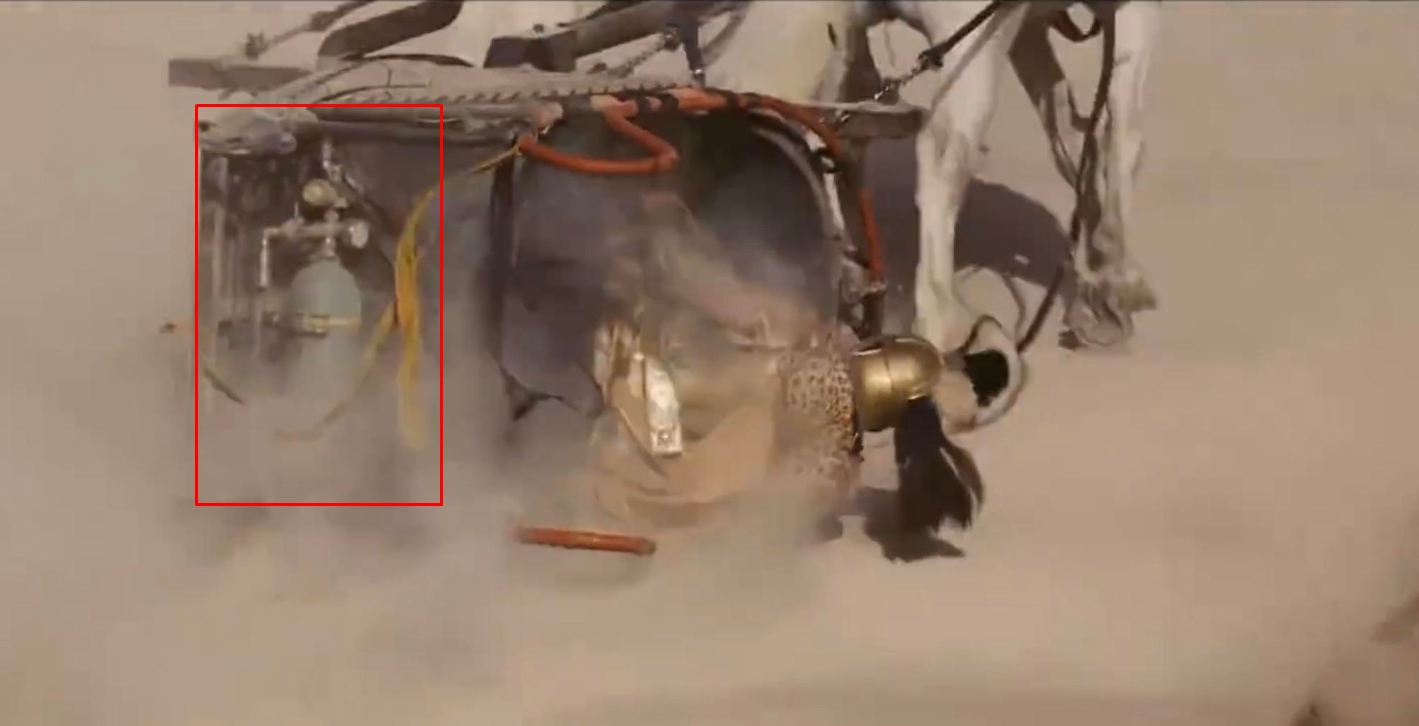 A modern gas cylinder is clearly visible on the back of a flipped Roman chariot. in Gladiator