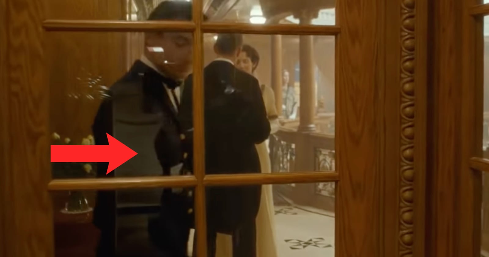 A cameraman is clearly reflected in the glass of the door as Jack and Rose run. in Titanic