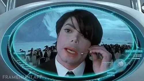 Michael Jackson appears on a giant screen, pleading to be promoted to "Agent M." in Men in Black II