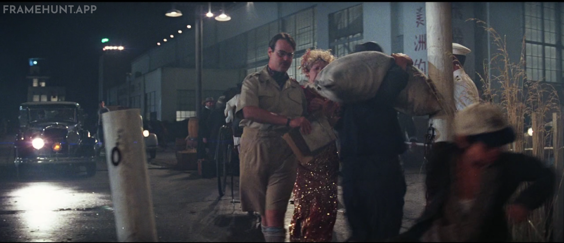 Dan Aykroyd plays the British officer who helps Indiana, Willie, and Short Round board the plane. in Indiana Jones and the Temple of Doom