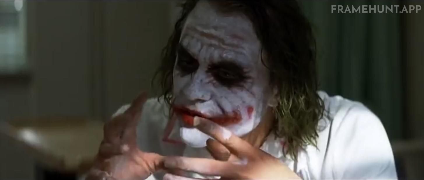 The Joker's fingers and hands are constantly stained with white and red makeup. in The Dark Knight