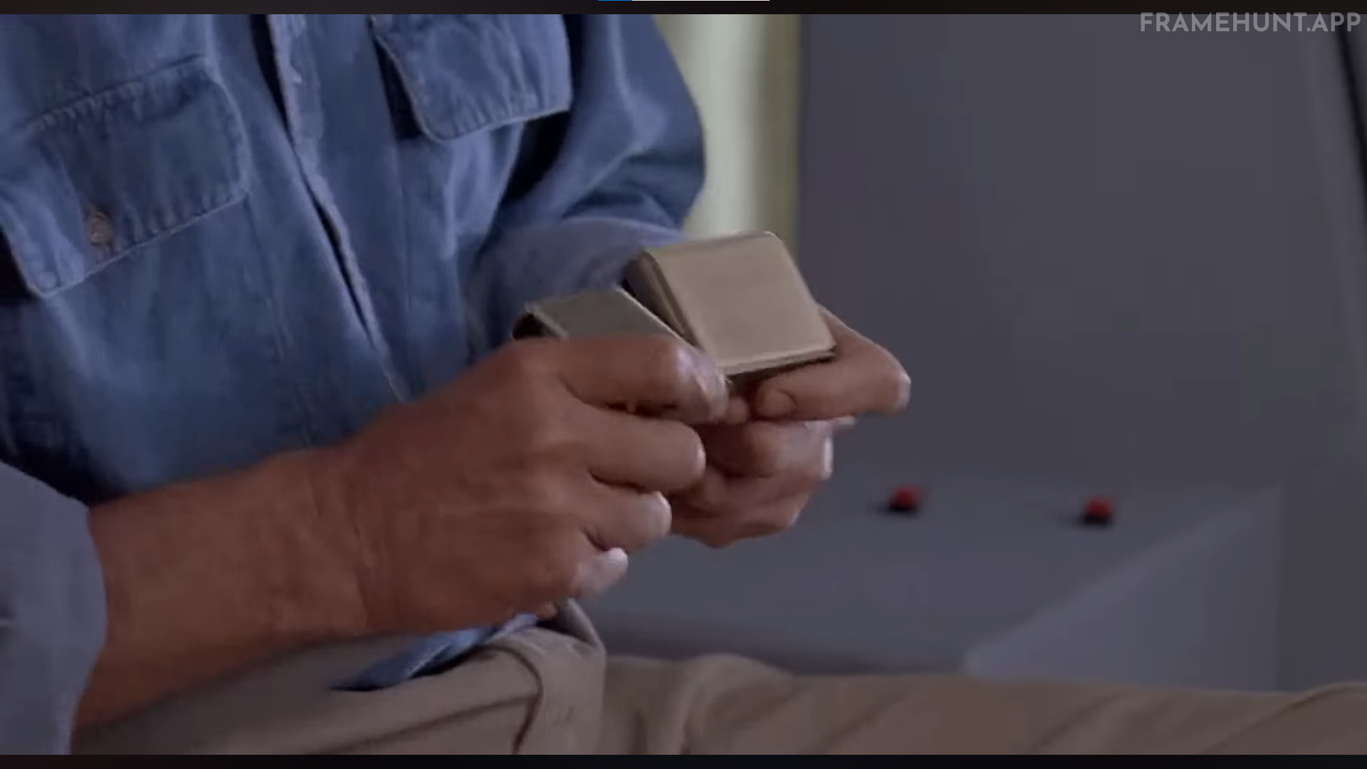 Dr. Alan Grant ties two "female" seatbelt ends together during the turbulent helicopter ride. in Jurassic Park