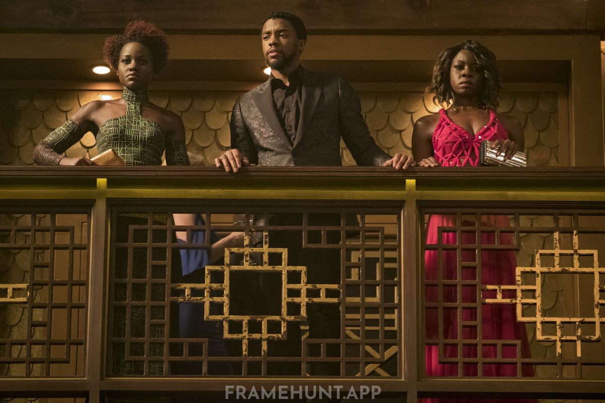 T'Challa, Nakia, and Okoye wear black, green, and red evening wear in the casino scene. in Black Panther