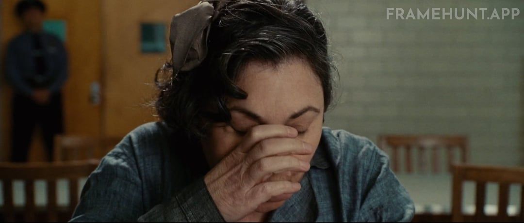 A patient is offered a glass of water, but she drinks from an empty hand, while the glass appears in the next shot. in Shutter Island