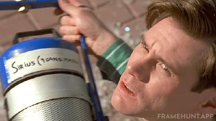 A stage spotlight crashes onto the street from the sky, bearing the label of the star "Sirius." in The Truman Show