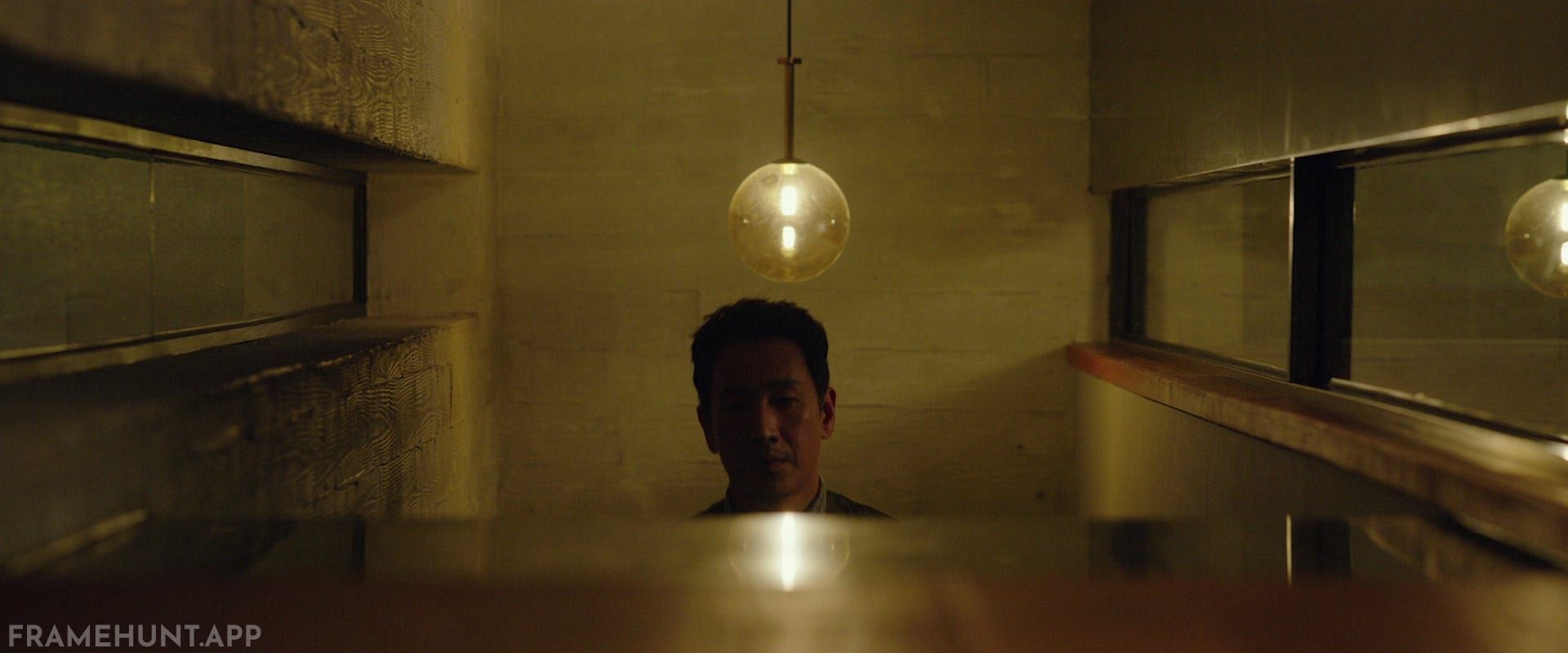 The motion-sensor lights on the staircase randomly flicker, which is later revealed to be Morse code. in Parasite