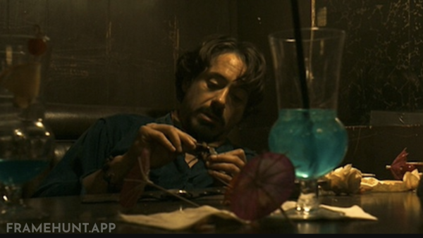 Robert Graysmith exclusively orders Aqua Velva cocktails, which are bright blue, visually matching his growing obsession. in Zodiac